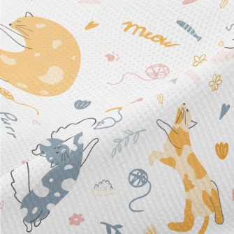 A Playful Kitten Piqué